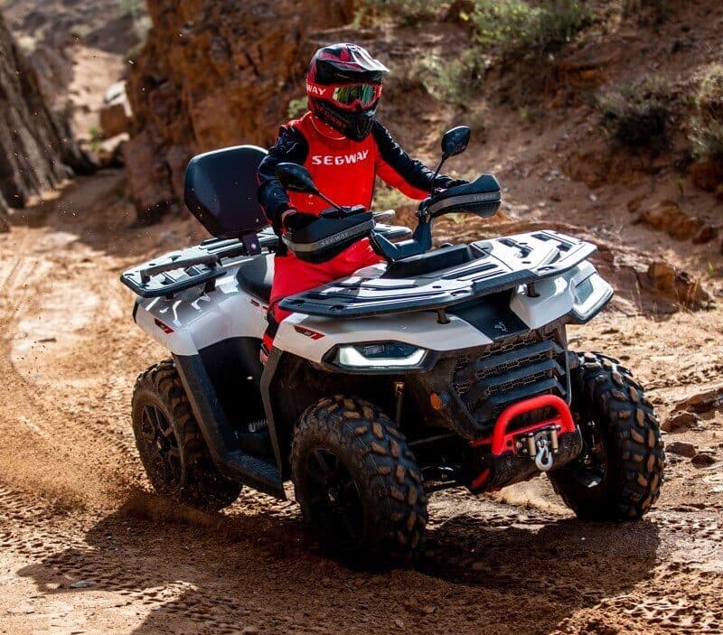 Segway Snarler AT5 in white and red among rocks