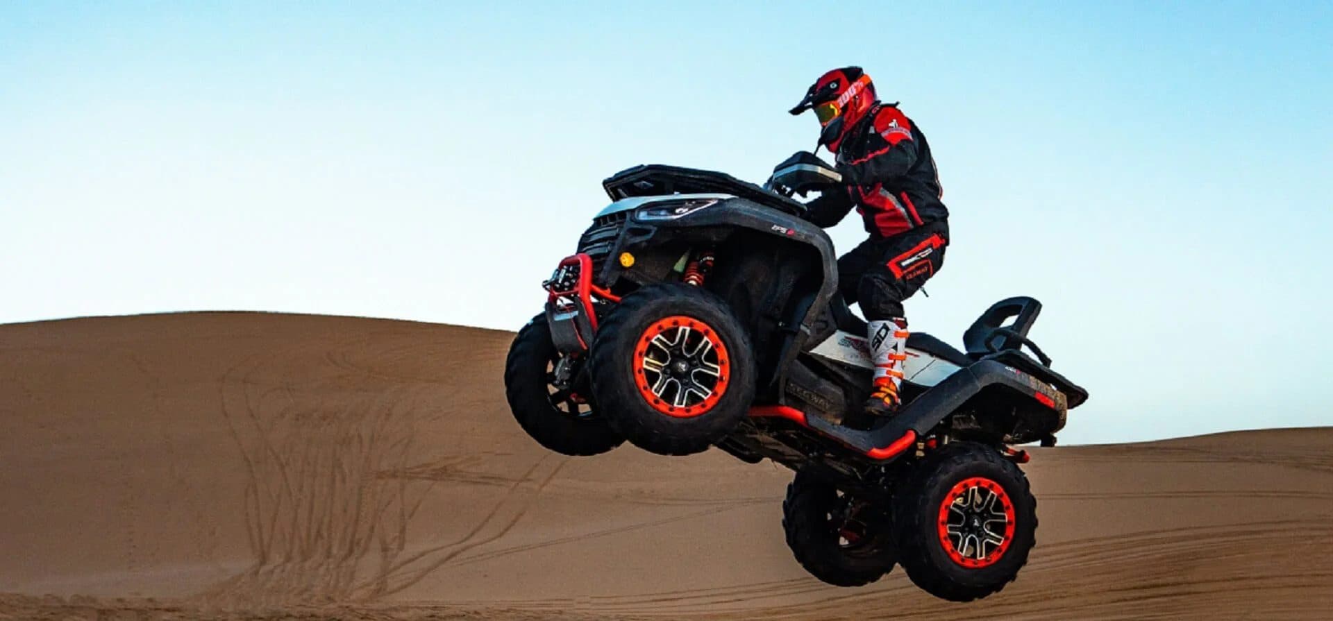 Segway Snarler AT6 lifting its front wheels on a dune