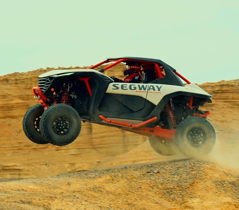 Segway Super Villain SX20T jumping over sand