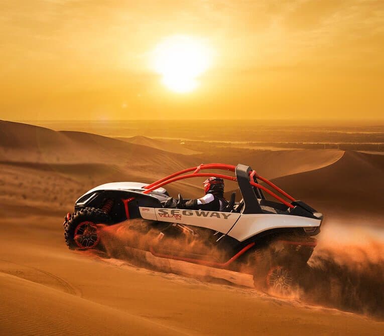 Segway Villain SX10 crossing the dunes at sunset