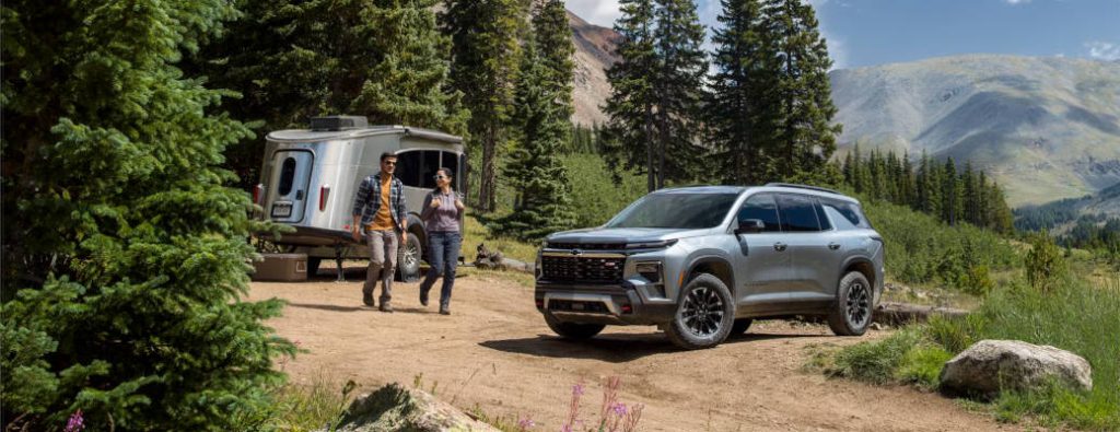 The 2025 Chevy Traverse at a camp site after towing a camping trailer